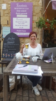 Jenny working remotely in French cafe